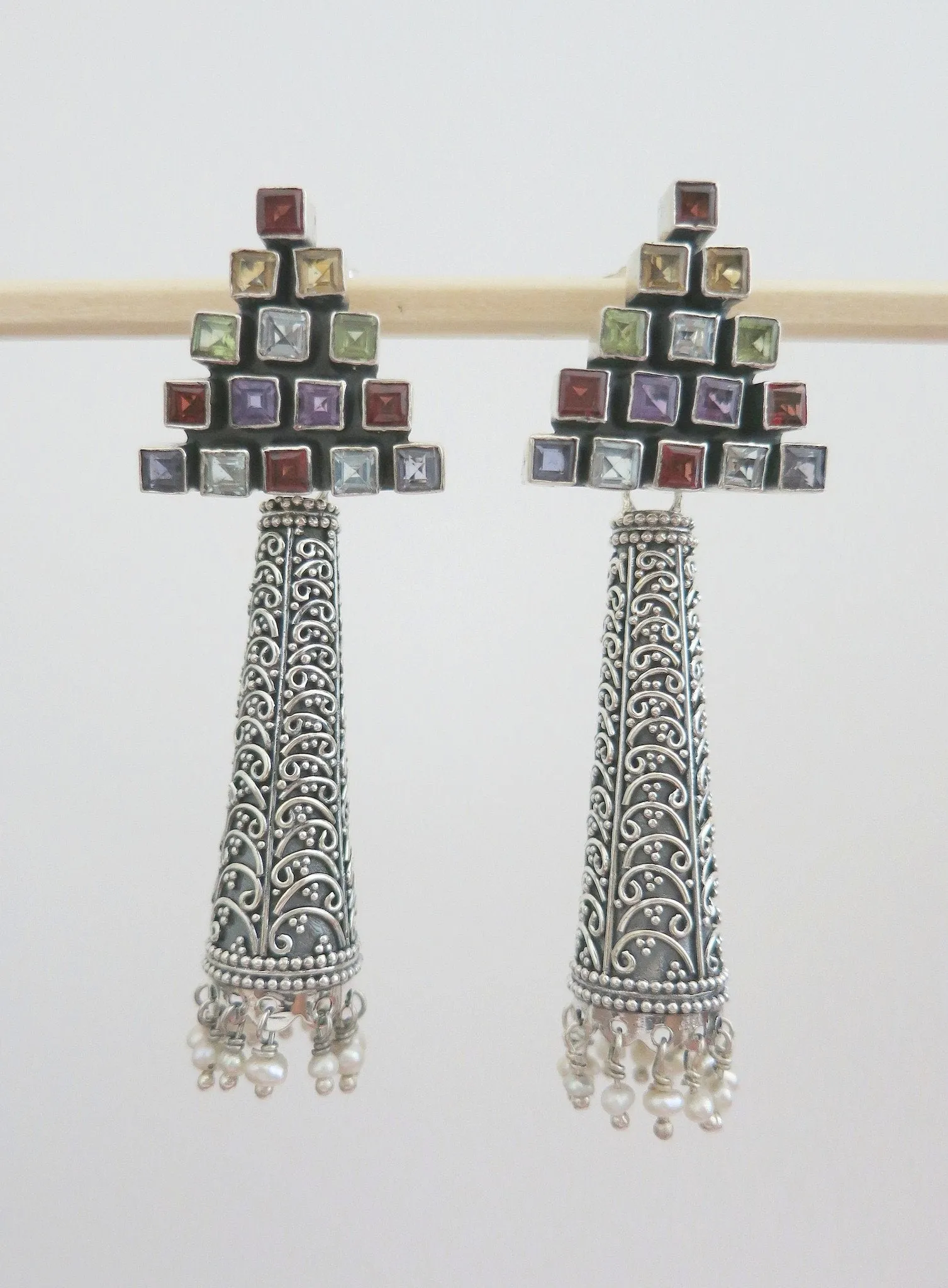 Dramatic, detachable long tubular jhumkas with triangular multicolor gemstone tops