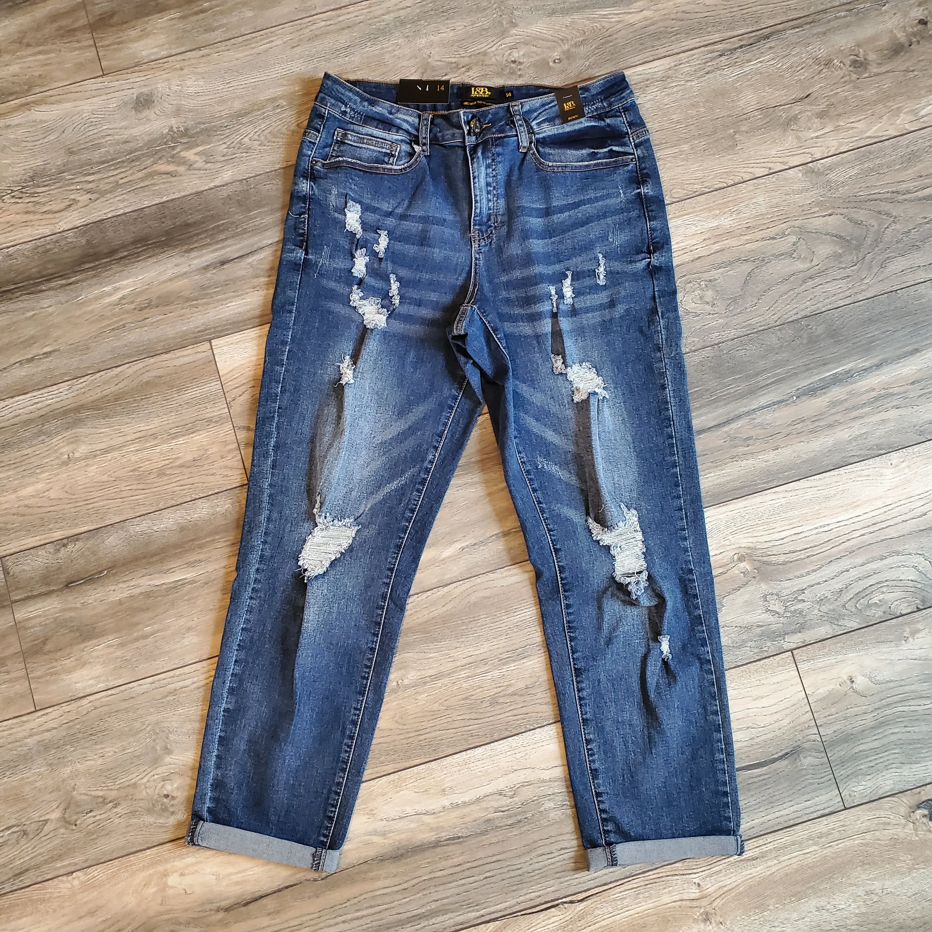   Mid Rise Distressed Skinny Jeans